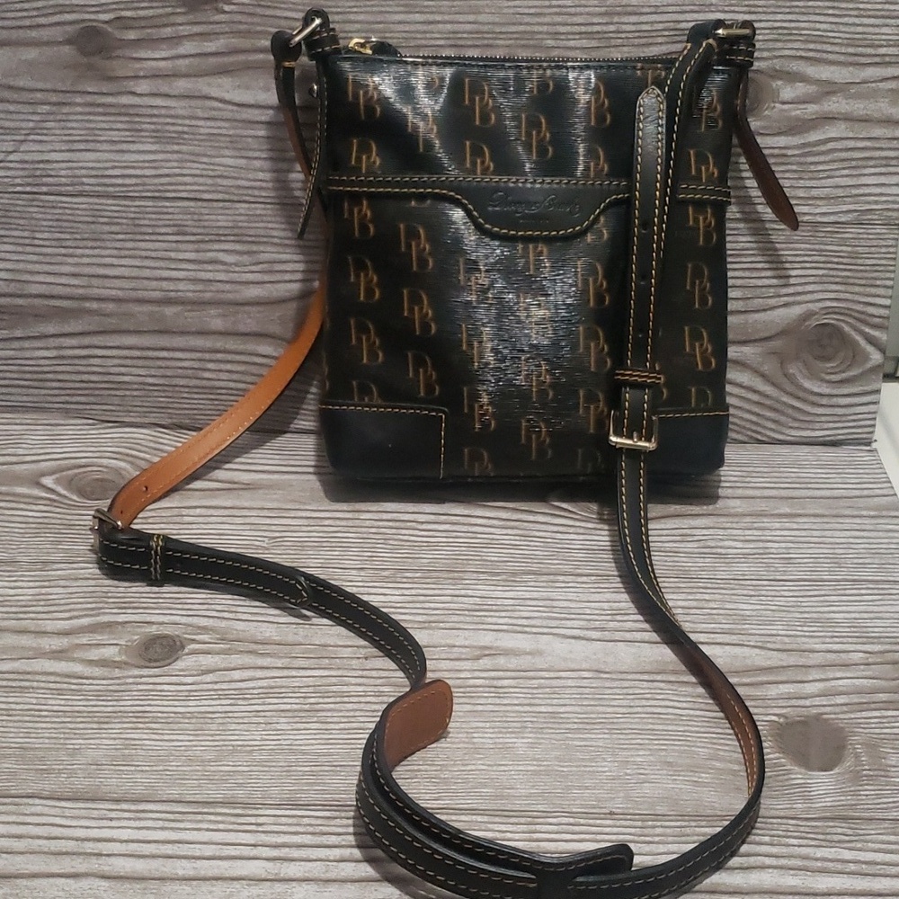 Dooney and Burke 1975 black canvas tan monogram crossbody bag